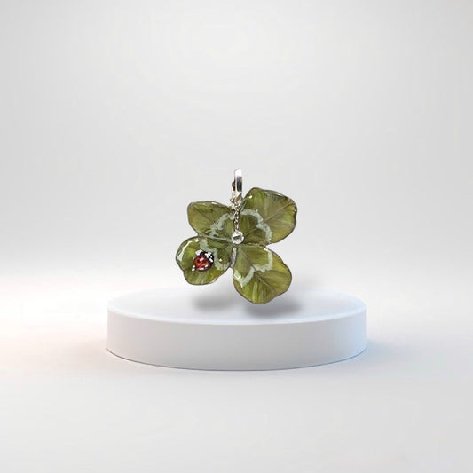 Ciondolo portafortuna con quadrifoglio e goccia di rugiada.N03B