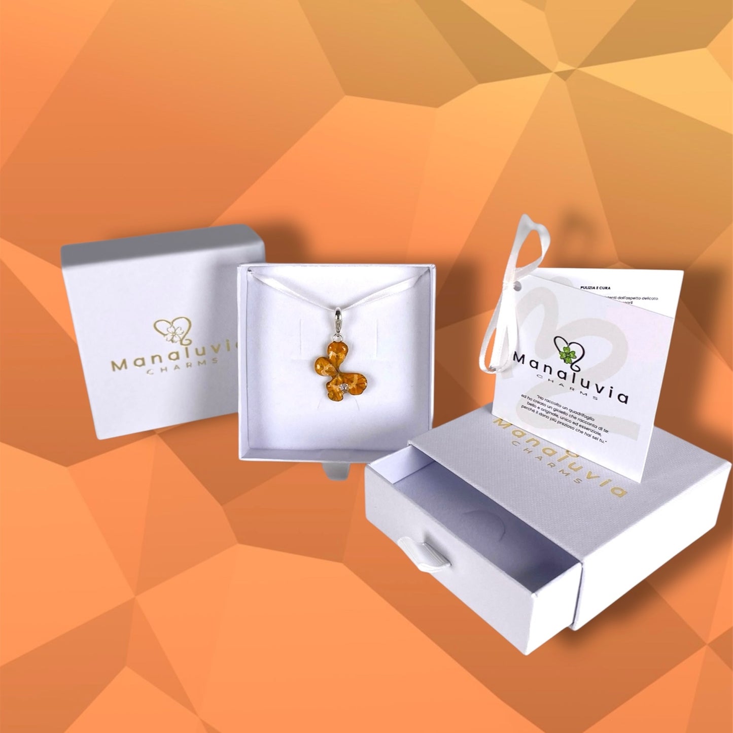 Chakra Svadhishthana, charm quadrifoglio, arancione con zircone.