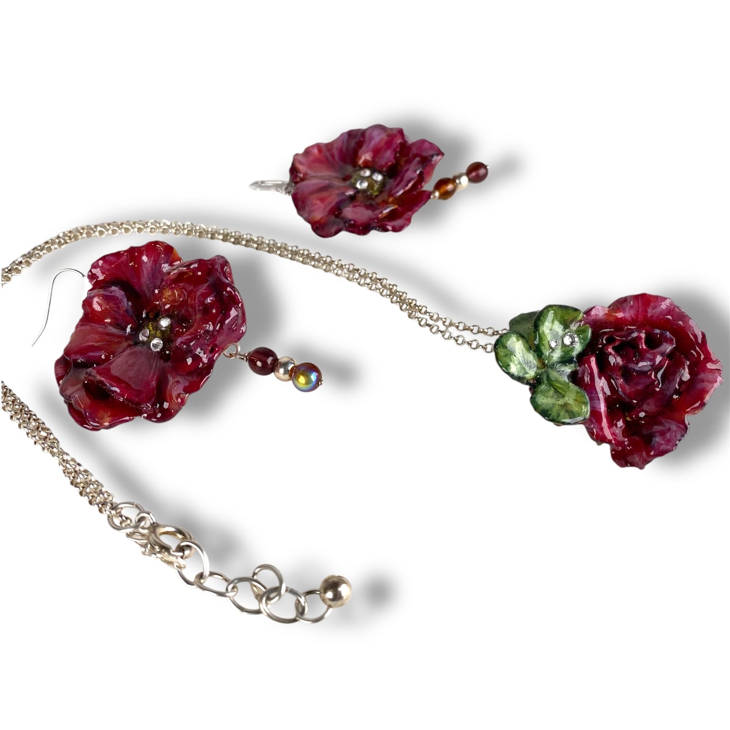 Parure floreale, con quadrifoglio portafortuna e catena in argento