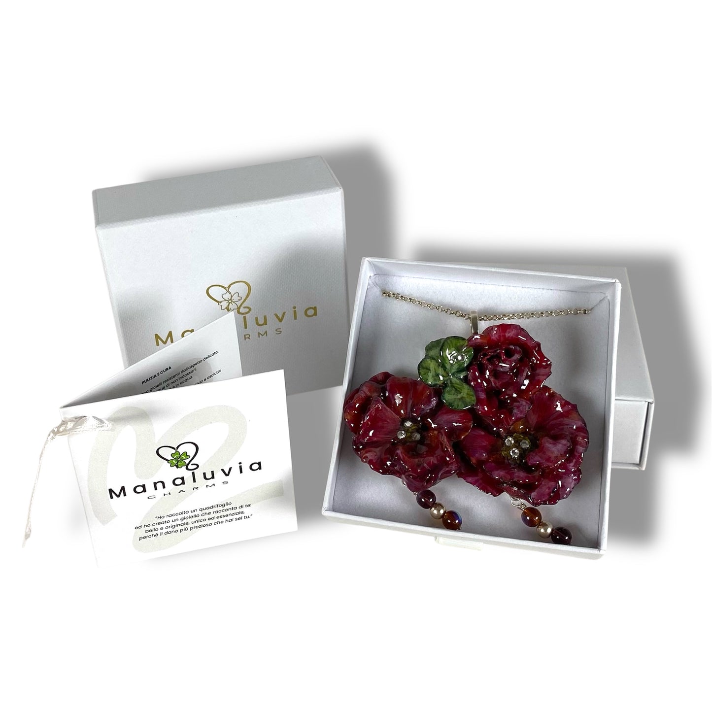 Parure floreale, con quadrifoglio portafortuna e catena in argento